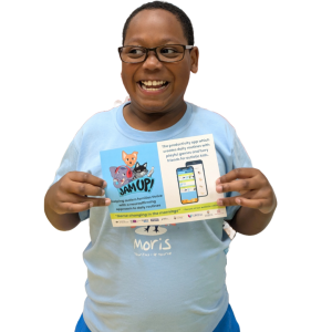 Boy smiling holding up Jam Up! leaflet