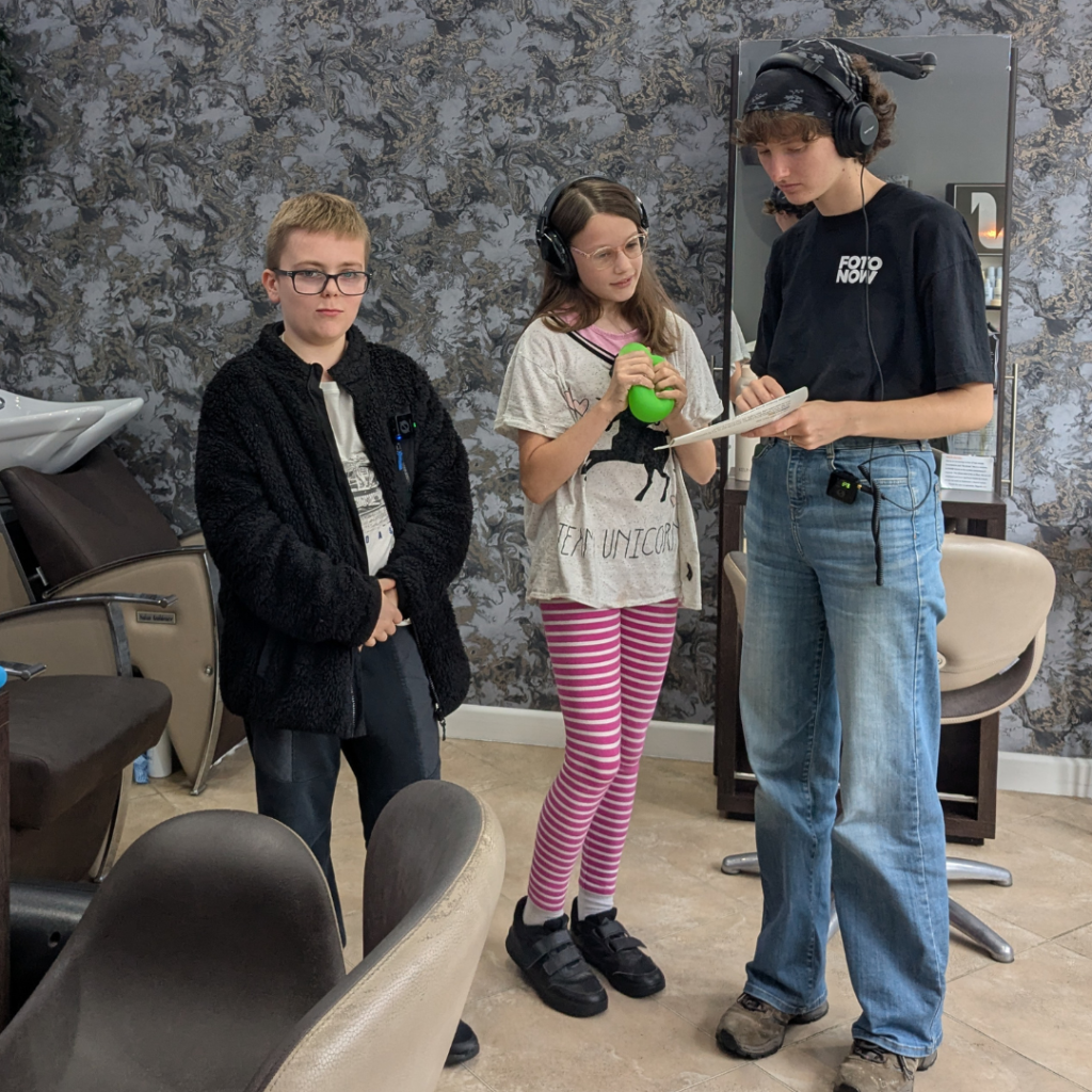 Children standing at a hairdressers